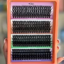 pestañas de ramito kiss bolsa plateada cja naranja